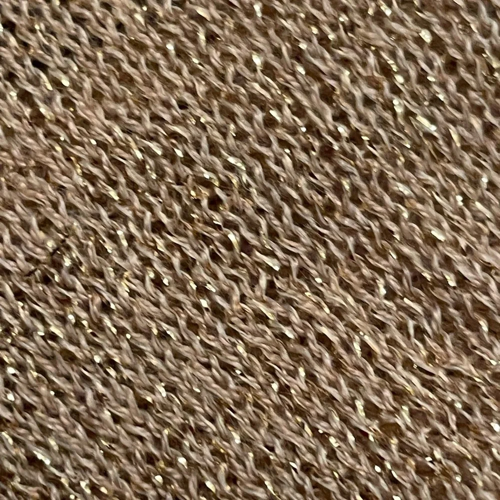 Pale pink infinity scarf with‎ gold threads.